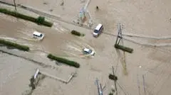 Japan Unprecedented Storm Warning 6 Dead 7,000 Stranded